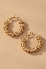 Diamond cut wavy coil hoop earrings