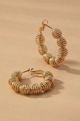 Diamond cut wavy coil hoop earrings