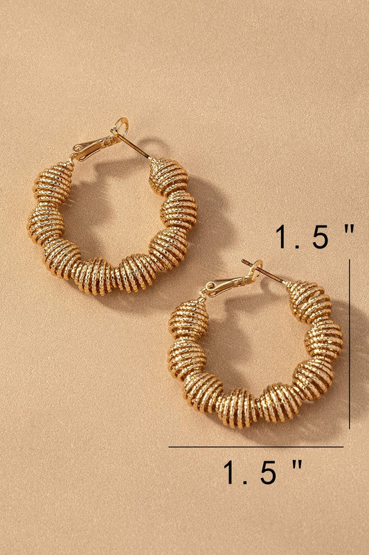 Diamond cut wavy coil hoop earrings